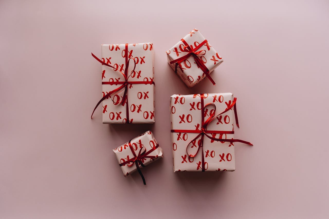 Crafting Captivating Headlines: Your awesome post title goes here A collection of beautifully wrapped gifts with red bows and XO pattern, perfect for celebrations.